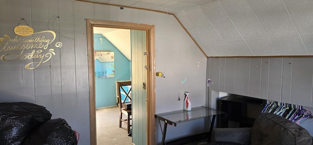 1220 Court St, Cheboygan, MI 49721 - carpeted living room with vaulted ceiling and wood walls