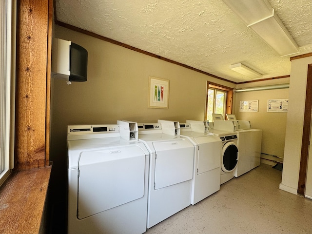 2757 Owens Dr, Houghton Lake, MI 48629 - community laundry featuring independent washer and dryer, ornamental molding, and a textured ceiling