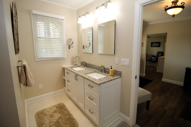 2403 N Perch Lake Dr, Gaylord, MI 49735 - full bath with ornamental molding, double vanity, wood finished floors, and baseboards