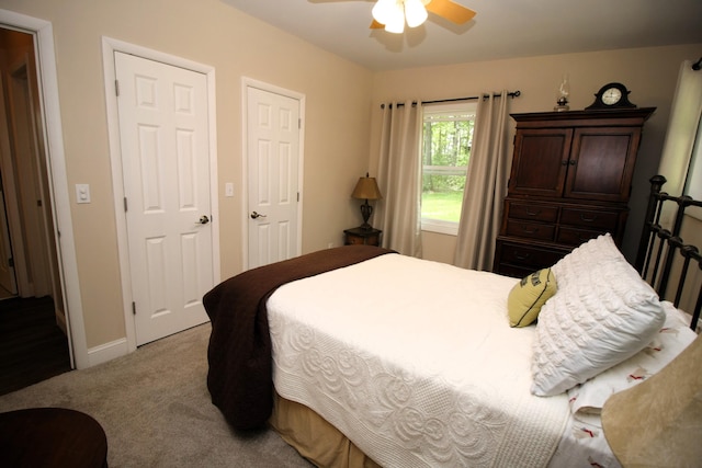 2403 N Perch Lake Dr, Gaylord, MI 49735 - bedroom featuring light colored carpet, baseboards, and ceiling fan