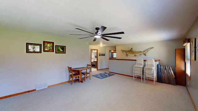 3400 Thornapple Trl, Lewiston, MI 49756 - sitting room with carpet floors, a ceiling fan, and baseboards