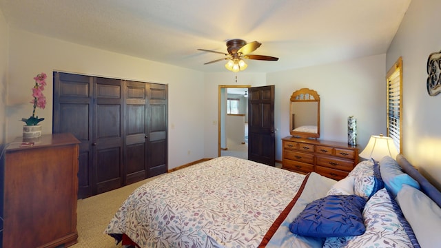 3400 Thornapple Trl, Lewiston, MI 49756 - bedroom with a closet, carpet, ceiling fan, and baseboards