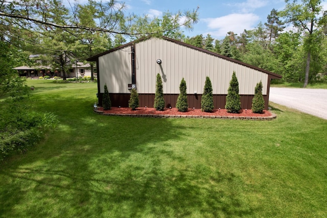 3400 Thornapple Trl, Lewiston, MI 49756 - view of side of property featuring a yard