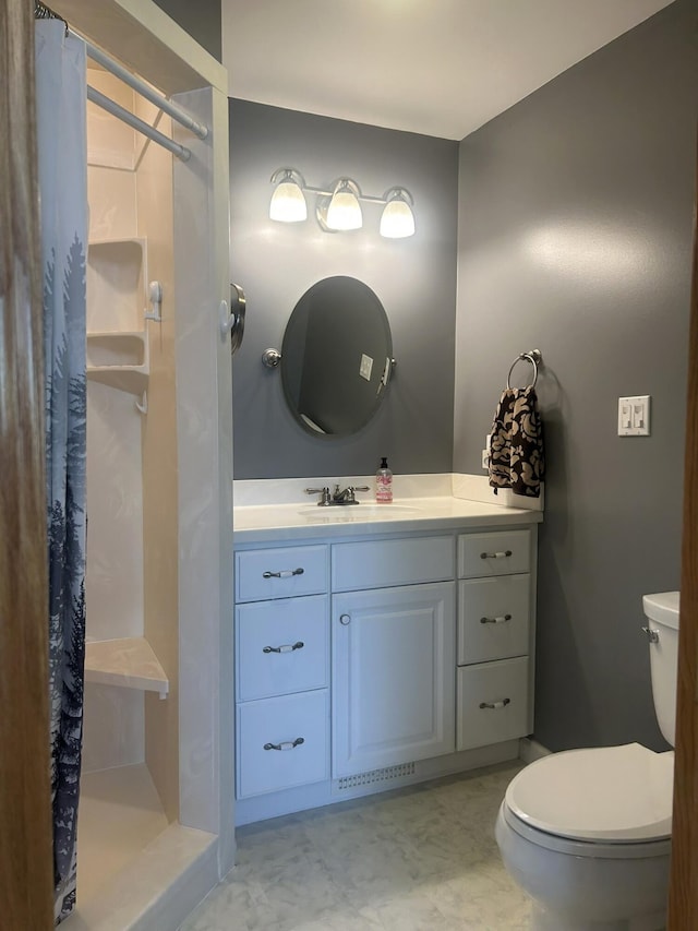 full bathroom with toilet, a stall shower, vanity, and tile patterned floors