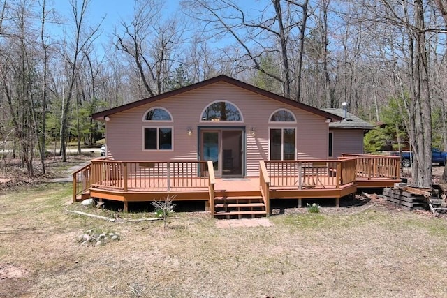 back of house featuring a deck