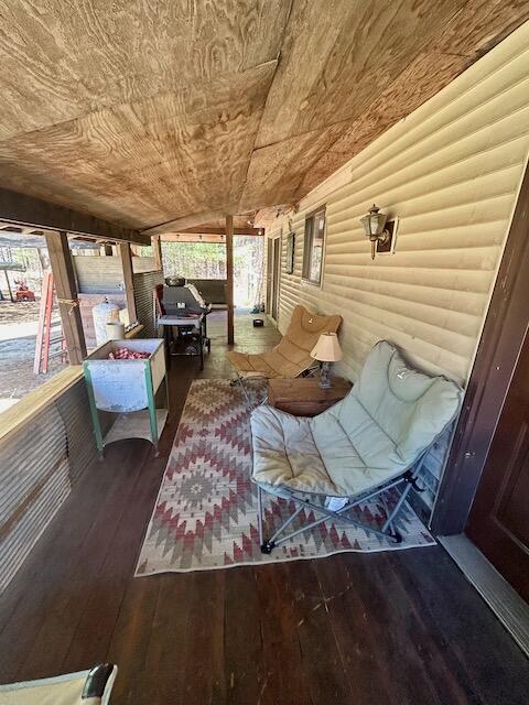 2165 E Cherry Creek Rd, Fairview, MI 48621 - sunroom featuring vaulted ceiling and an outdoor hangout area