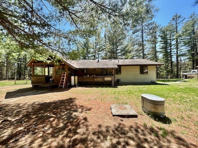 2165 E Cherry Creek Rd, Fairview, MI 48621 - back of property with a lawn