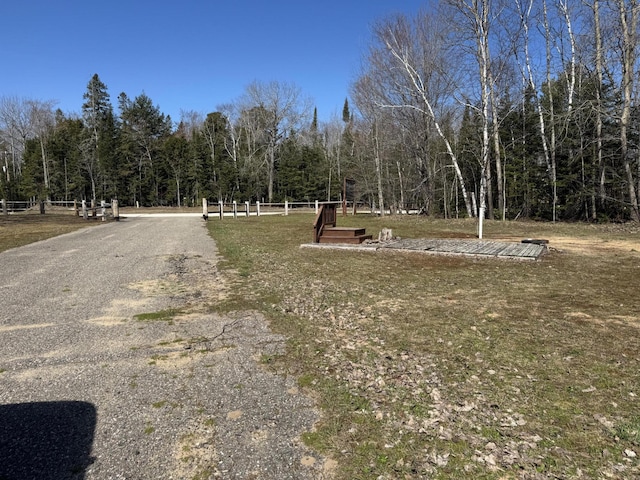 view of home's community with a forest view