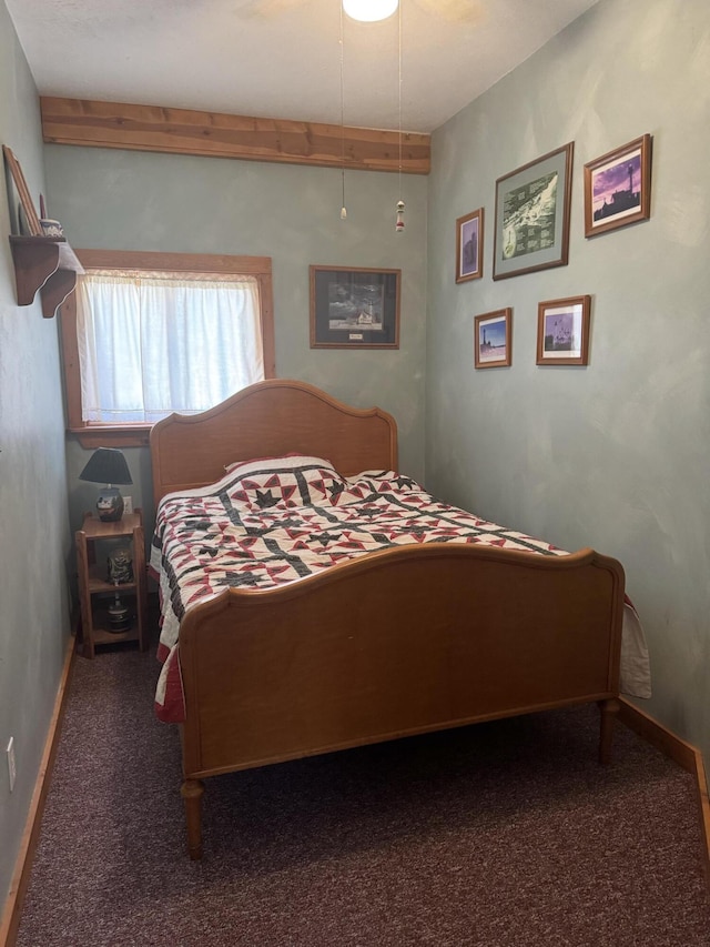 bedroom with carpet and baseboards