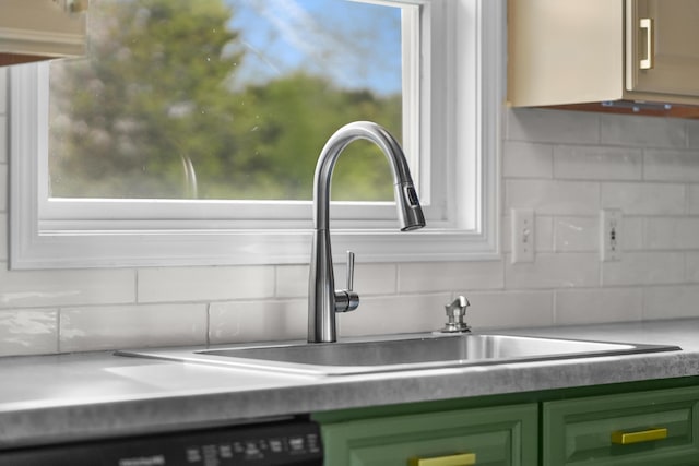 201 Country Ct, Houghton Lake, MI 48629 - kitchen view of decorative backsplash, a sink, and black dishwasher