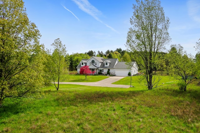 201 Country Ct, Houghton Lake, MI 48629 - view of front facade with concrete driveway, a garage, and a front yard