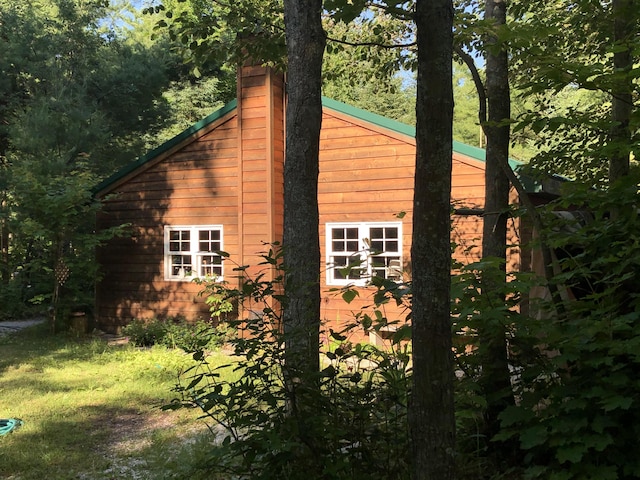 4550 E Simmons Rd, Hessel, MI 49745 - view of property exterior featuring a chimney