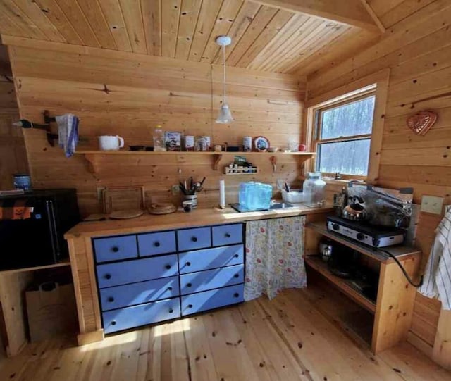 4550 E Simmons Rd, Hessel, MI 49745 - kitchen with wooden ceiling, wood walls, light wood finished floors, and open shelves