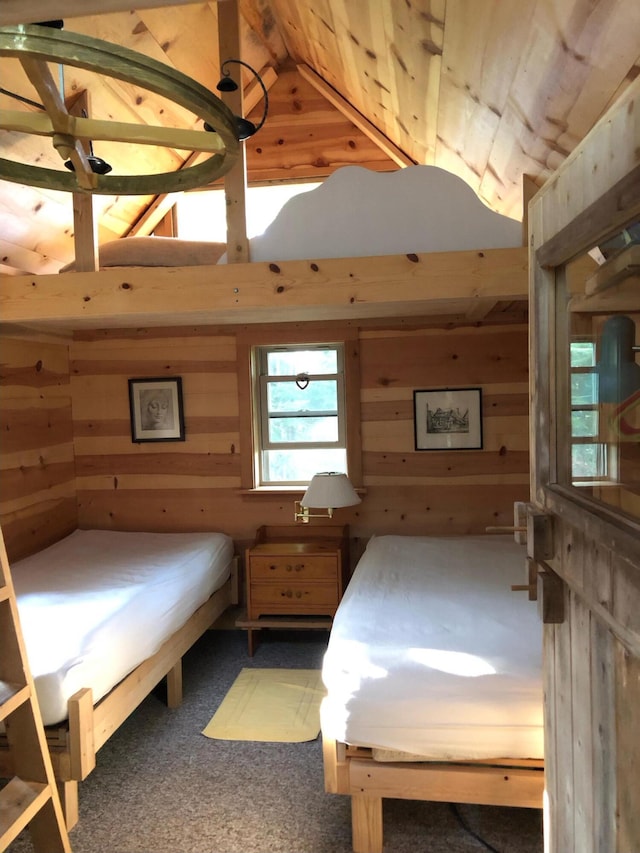 4550 E Simmons Rd, Hessel, MI 49745 - bedroom featuring wood walls, carpet flooring, and lofted ceiling