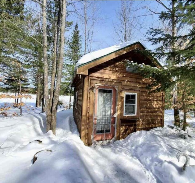 4550 E Simmons Rd, Hessel, MI 49745 - view of snow covered structure