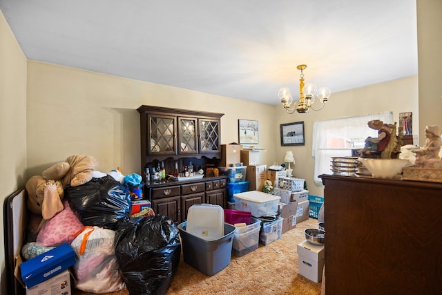 7654 M 32 E, Johannesburg, MI 49751 - dining area featuring carpet flooring and a chandelier