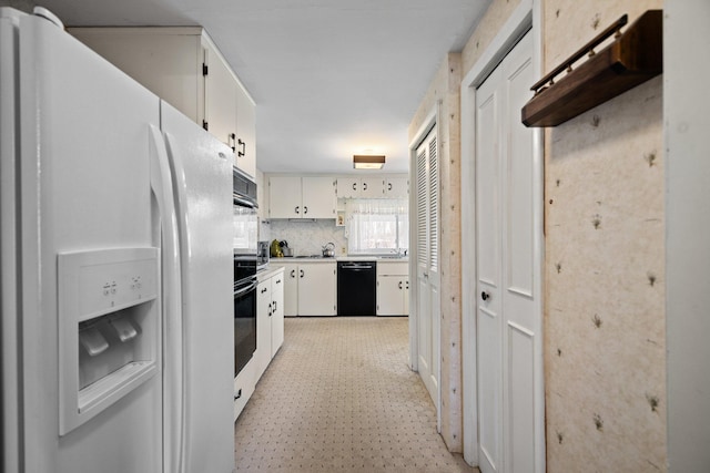 7654 M 32 E, Johannesburg, MI 49751 - kitchen featuring white fridge with ice dispenser, dishwasher, white cabinetry, light countertops, and decorative backsplash