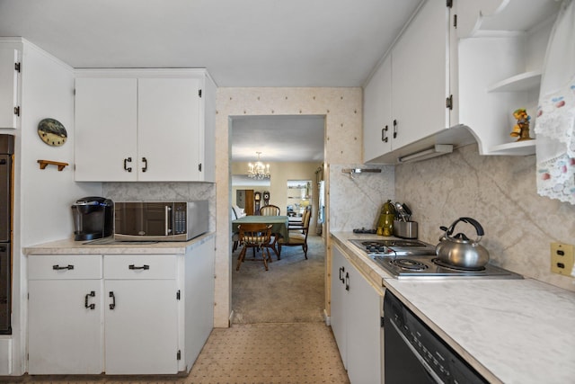 7654 M 32 E, Johannesburg, MI 49751 - kitchen featuring appliances with stainless steel finishes, light countertops, open shelves, and white cabinets