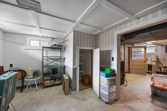 7654 M 32 E, Johannesburg, MI 49751 - basement with concrete block wall, healthy amount of natural light, and wallpapered walls