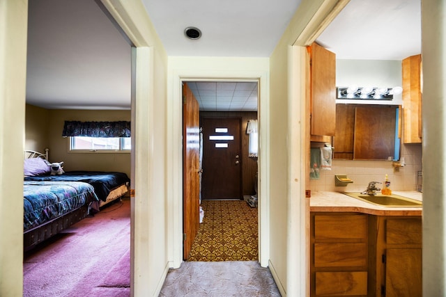 7654 M 32 E, Johannesburg, MI 49751 - hall with a sink and carpet floors