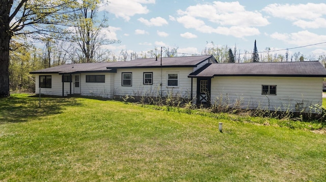 7654 M 32 E, Johannesburg, MI 49751 - back of property featuring a lawn