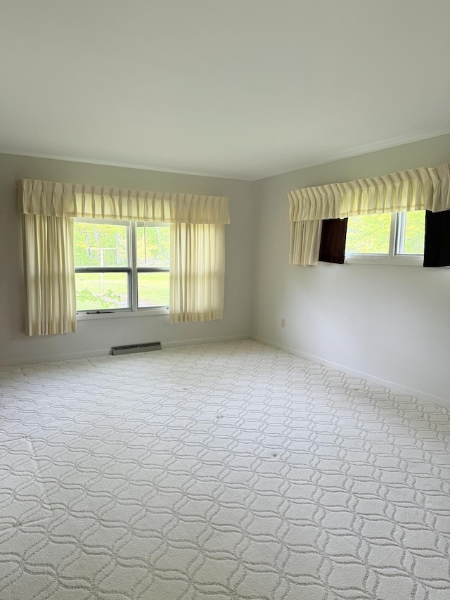 7654 M 32 E, Johannesburg, MI 49751 - unfurnished room featuring baseboards and carpet floors