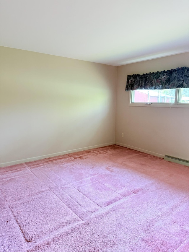 7654 M 32 E, Johannesburg, MI 49751 - empty room with a baseboard radiator, carpet floors, and baseboards