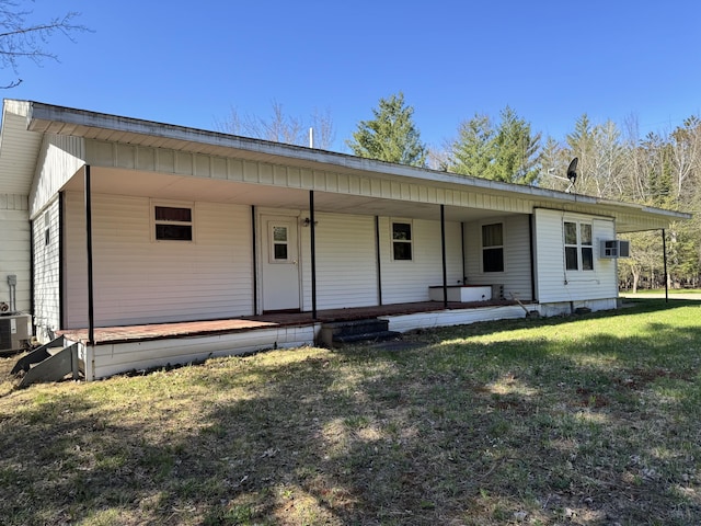 1321 Eagle Point Rd, Grayling, MI 49738 - view of front facade with a front yard, a porch, and central air condition unit