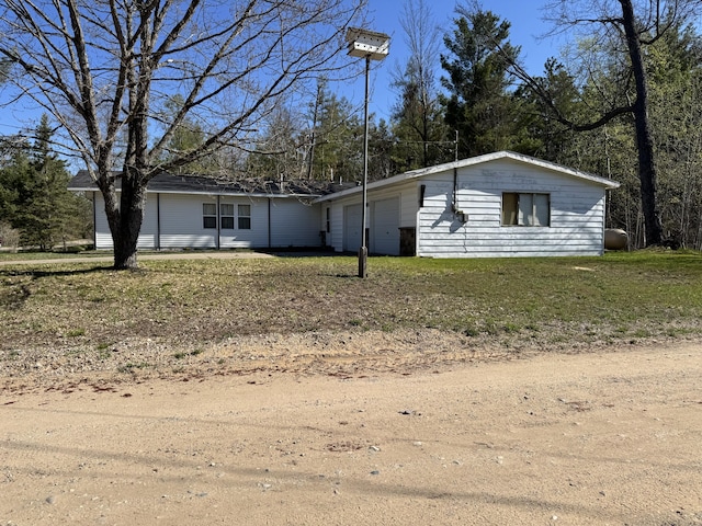 1321 Eagle Point Rd, Grayling, MI 49738 - ranch-style house with an attached garage