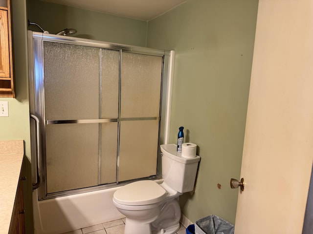 1321 Eagle Point Rd, Grayling, MI 49738 - bathroom featuring tile patterned flooring, vanity, combined bath / shower with glass door, and toilet