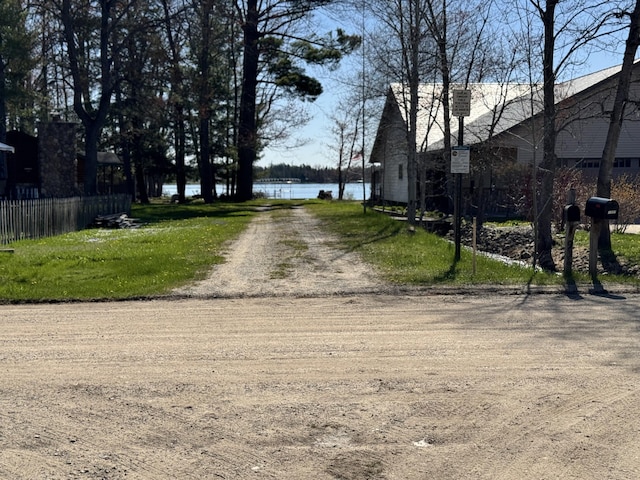 1321 Eagle Point Rd, Grayling, MI 49738 - view of dirt / gravel road featuring a water view