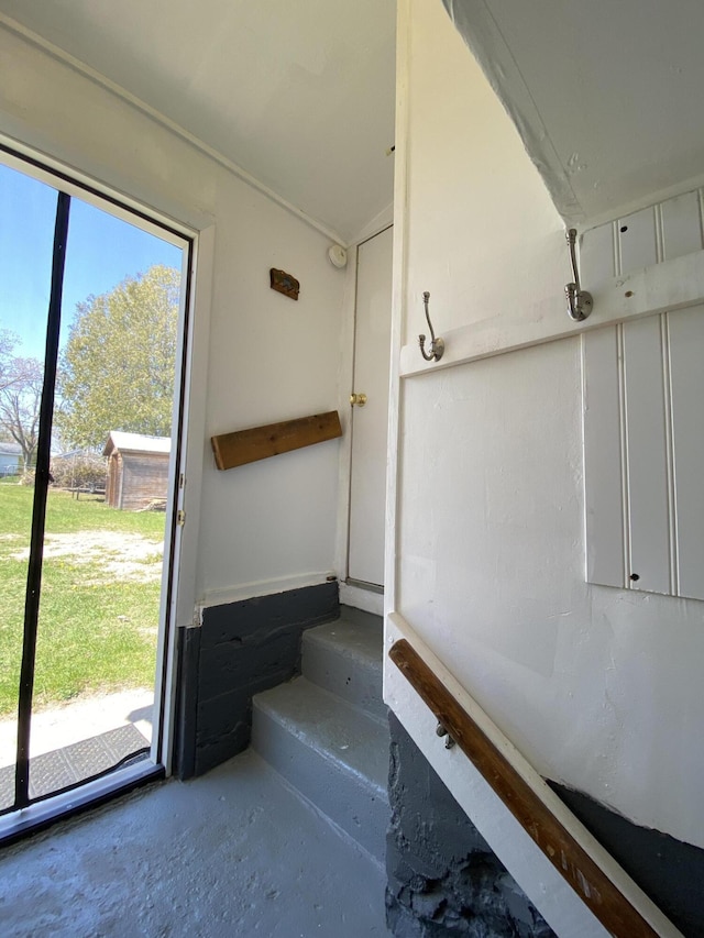 737 S First St, Rogers City, MI 49779 - stairway with unfinished concrete floors