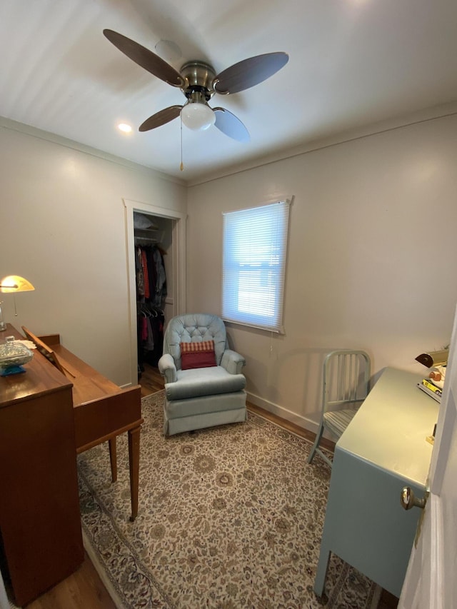 737 S First St, Rogers City, MI 49779 - office featuring wood finished floors, ceiling fan, crown molding, and baseboards
