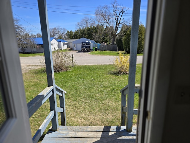 26 Michigan St, Saint Ignace, MI 49781 - view of grassy yard with dirt driveway and a residential view