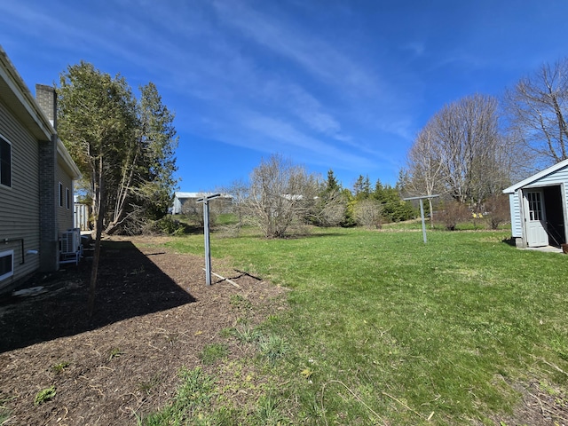 26 Michigan St, Saint Ignace, MI 49781 - view of green lawn featuring central air condition unit