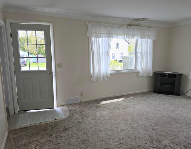 26 Michigan St, Saint Ignace, MI 49781 - foyer with healthy amount of natural light, ornamental molding, carpet flooring, and baseboards