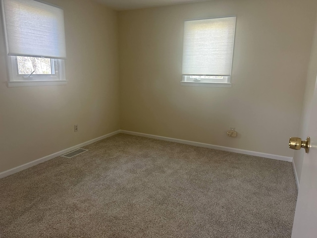 1371 Wayne Rd, Alpena, MI 49707 - spare room featuring carpet floors and baseboards