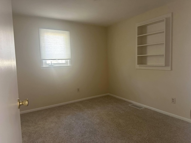 1371 Wayne Rd, Alpena, MI 49707 - carpeted empty room featuring baseboards
