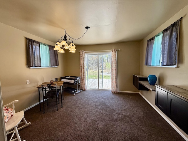 1073 S Hoot Owl Ln, Grayling, MI 49738 - dining space featuring a chandelier, dark colored carpet, and baseboards