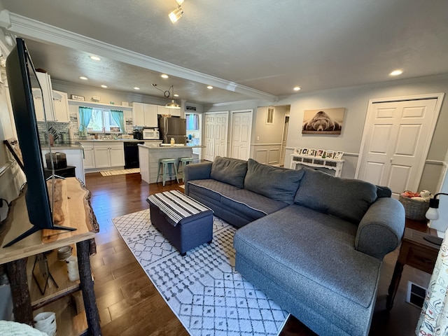 1073 S Hoot Owl Ln, Grayling, MI 49738 - living area featuring ornamental molding, dark wood finished floors, and recessed lighting