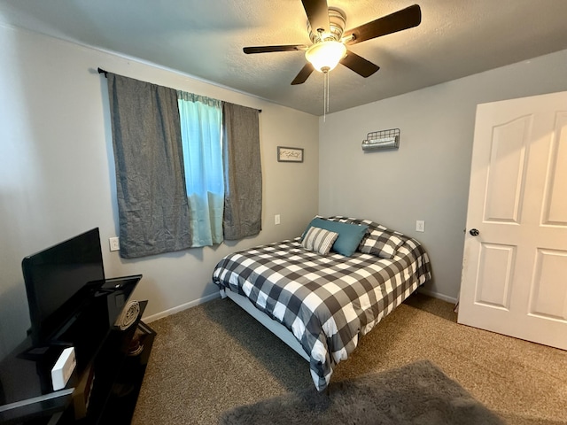 1073 S Hoot Owl Ln, Grayling, MI 49738 - carpeted bedroom with baseboards and a ceiling fan