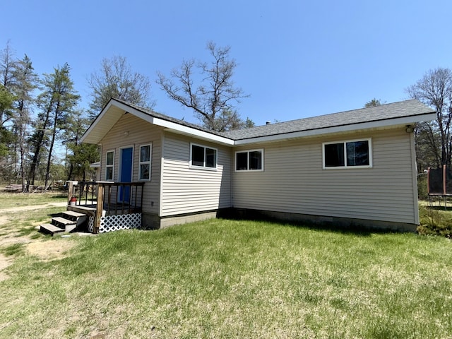 1073 S Hoot Owl Ln, Grayling, MI 49738 - back of property with a lawn