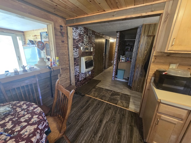 3625 Mckinley Rd, Mio, MI 48647 - hallway featuring heating unit, wood walls, dark wood-type flooring, and wooden ceiling
