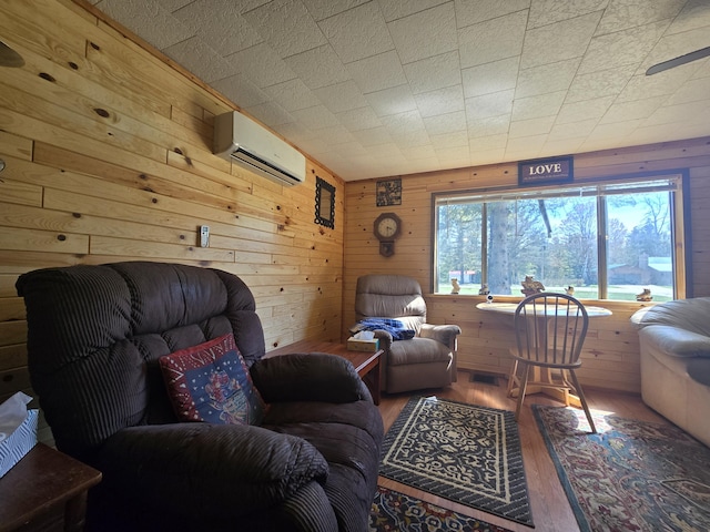 3625 Mckinley Rd, Mio, MI 48647 - living area featuring an AC wall unit, wood finished floors, and wooden walls
