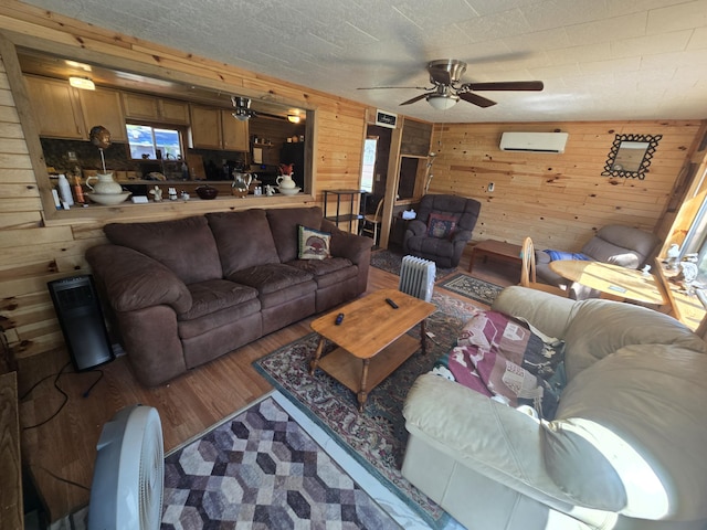 3625 Mckinley Rd, Mio, MI 48647 - living area with wooden walls, a ceiling fan, and wood finished floors