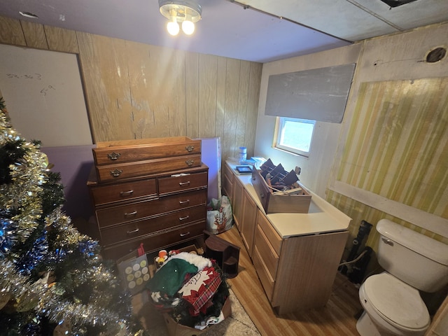 3625 Mckinley Rd, Mio, MI 48647 - bedroom with wood walls and light wood finished floors