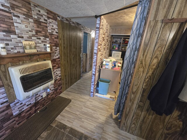 3625 Mckinley Rd, Mio, MI 48647 - hall featuring heating unit and wooden walls