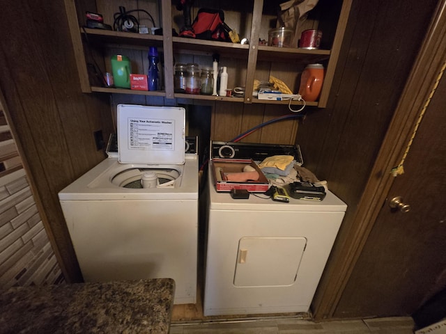 3625 Mckinley Rd, Mio, MI 48647 - washroom featuring washing machine and clothes dryer and wooden walls
