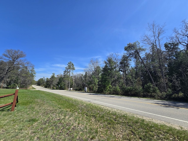 3625 Mckinley Rd, Mio, MI 48647 - view of asphalt street featuring a forest view