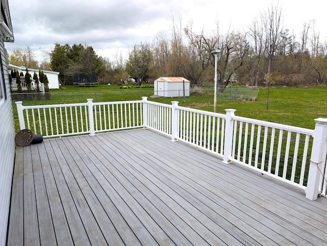 615 Duncan Ave, Cheboygan, MI 49721 - deck featuring a shed and an outbuilding